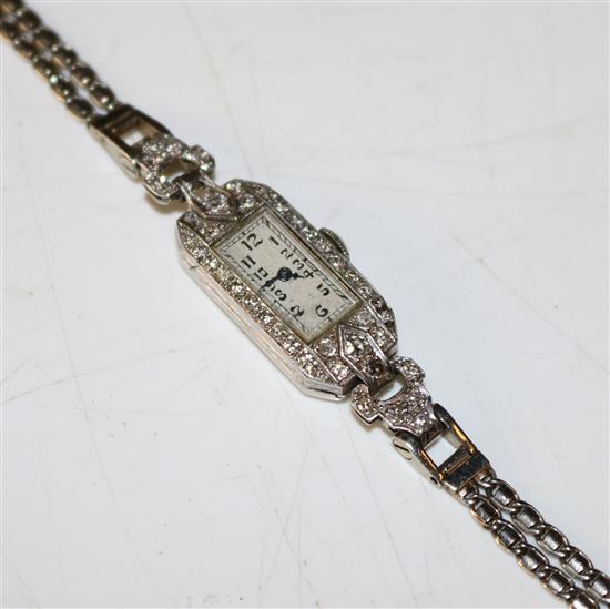 A ladys 1930s platinum and diamond cocktail watch, max. length approx. 6.25in.